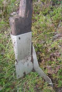 Metal spade on wooden stave with wing to cut square corners